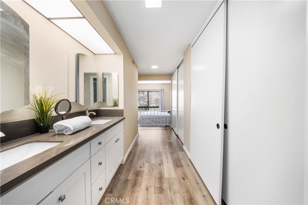 11 Palos, Unit 55 Irvine, CA 92612 - Photo 22 of 25 a hallway with view of living room