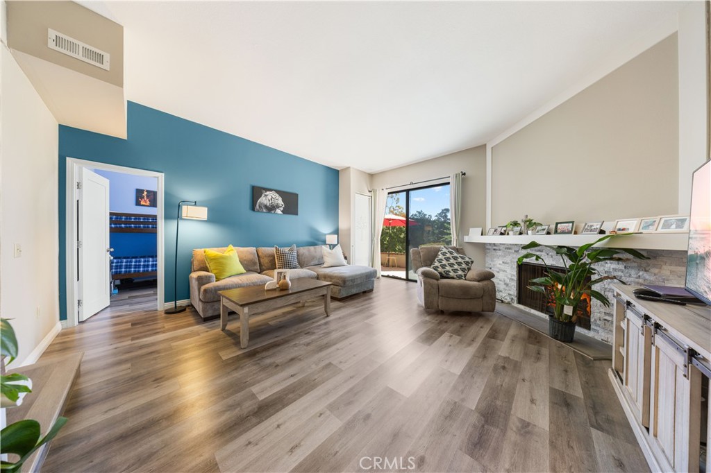 11 Palos, Unit 55 Irvine, CA 92612 - Photo 23 of 25 a living room with furniture and a wooden floor