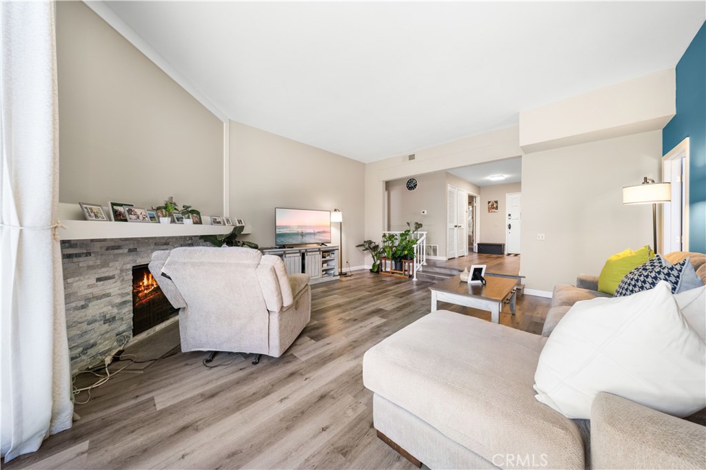 11 Palos, Unit 55 Irvine, CA 92612 - Photo 24 of 25 a living room with furniture and wooden floor