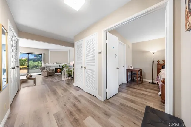 a view of a living room and a wooden floor