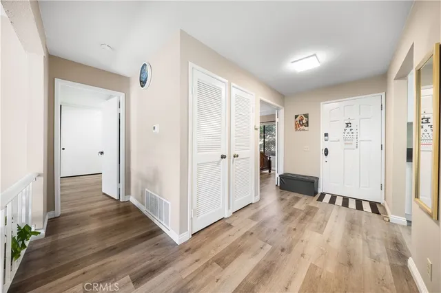 wooden floor with white walls