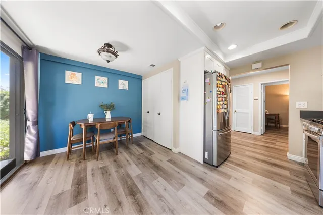 a view of a livingroom with furniture and wooden floor