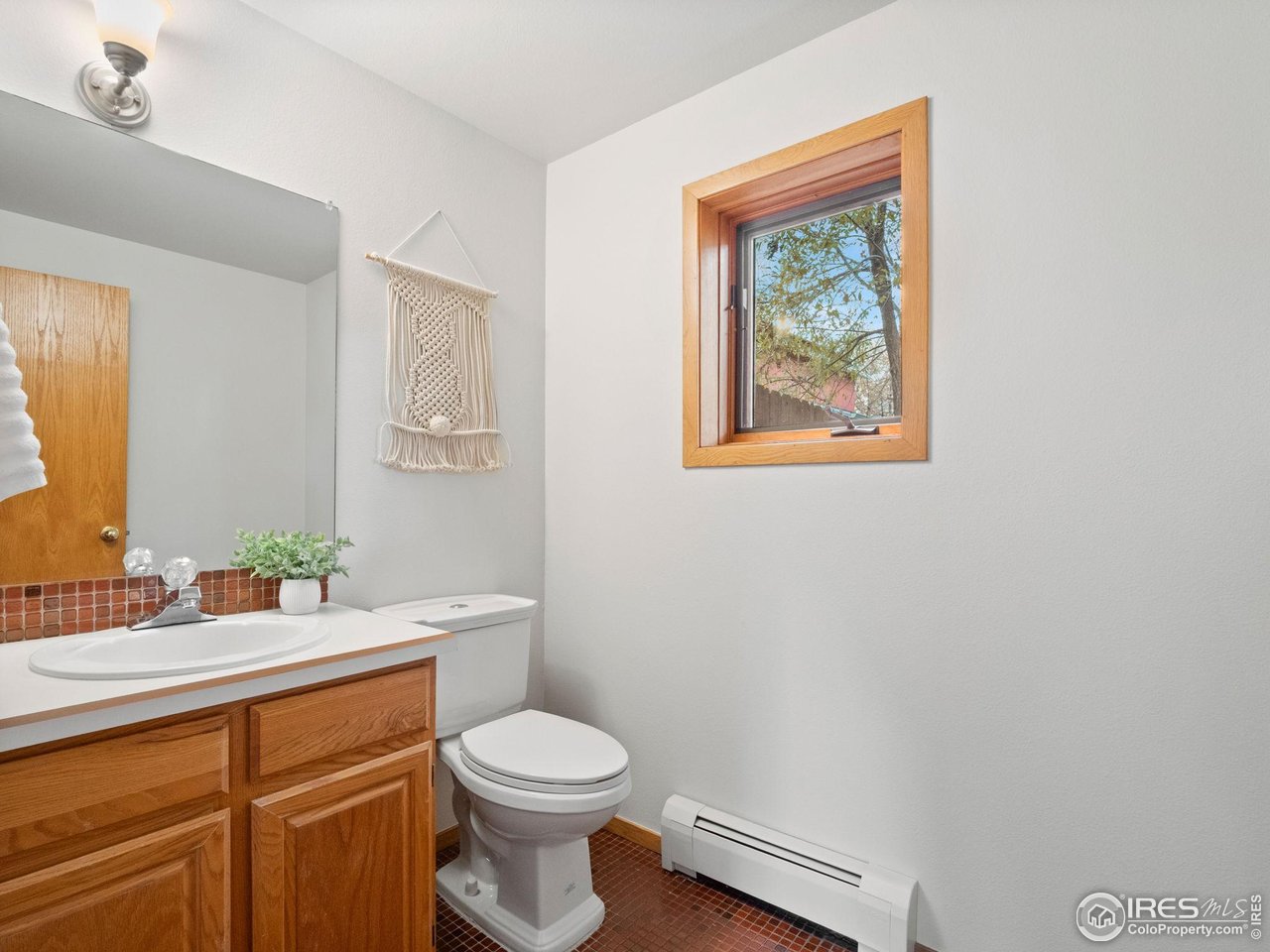2680 Fremont Street Boulder, CO 80304 - Photo 11 of 28 a bathroom with a toilet a sink and a mirror