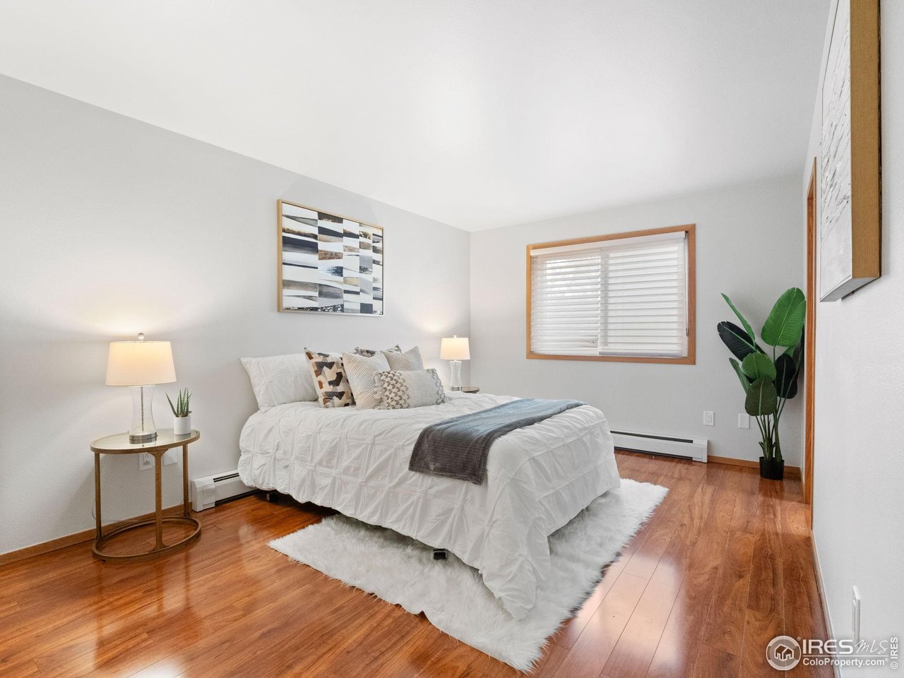 2680 Fremont Street Boulder, CO 80304 - Photo 13 of 28 a bedroom with a bed lamp and window