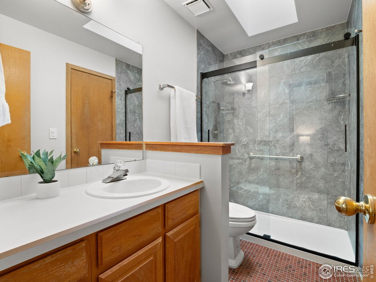 2680 Fremont Street Boulder, CO 80304 - Photo 19 of 28 a bathroom with a sink a toilet and shower