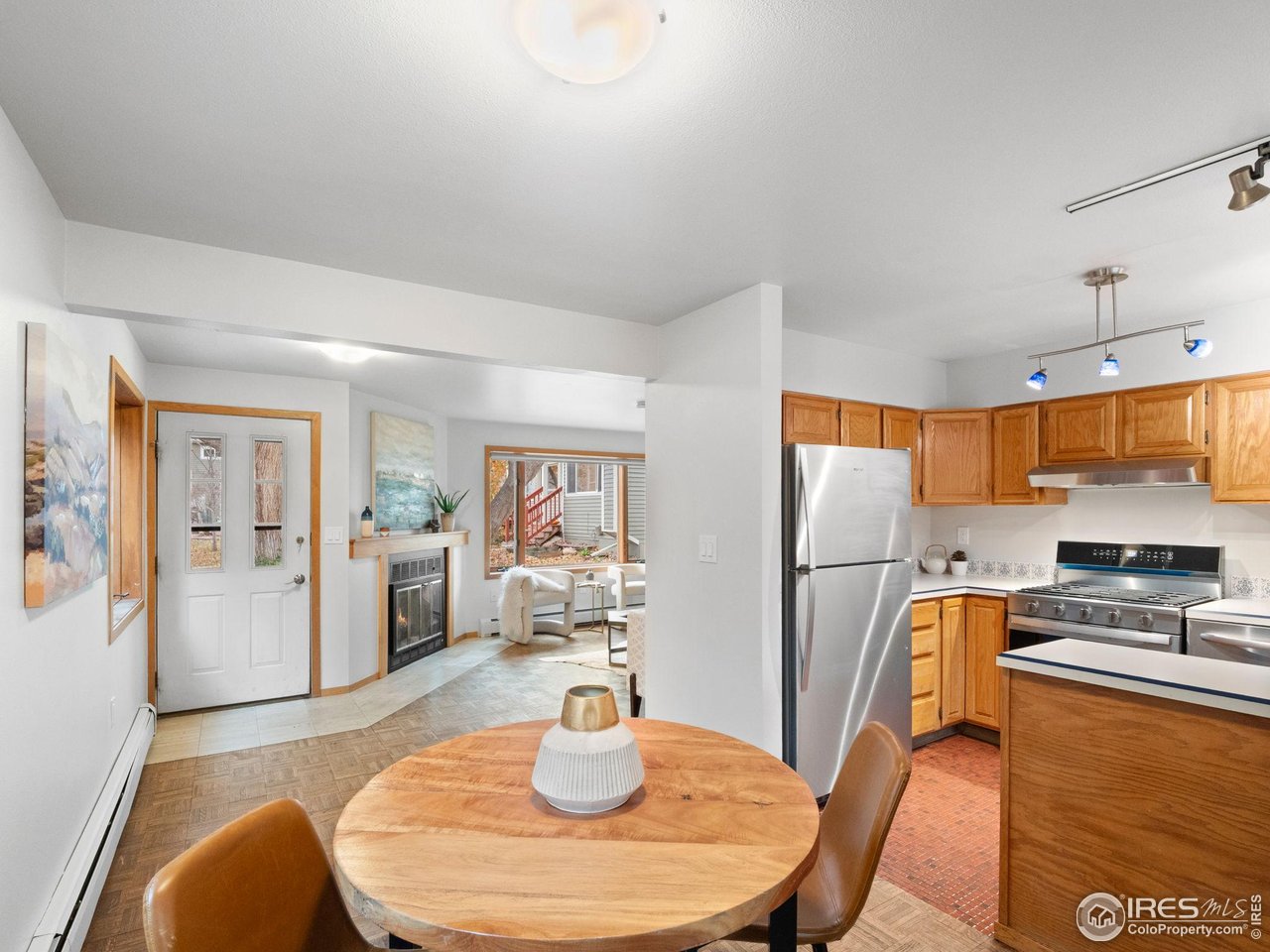 2680 Fremont Street Boulder, CO 80304 - Photo 7 of 28 a kitchen with stainless steel appliances a dining table and chairs