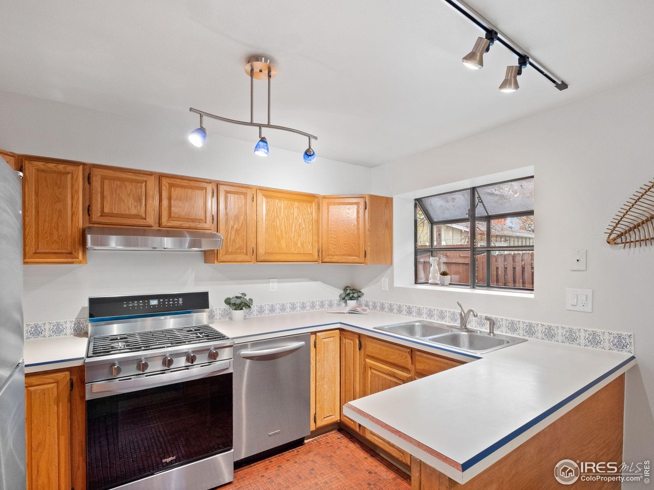 2680 Fremont Street Boulder, CO 80304 - Photo 8 of 28 a kitchen with stainless steel appliances granite countertop a sink stove and refrigerator