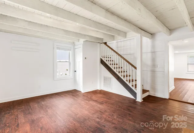 a view of entryway with wooden floor