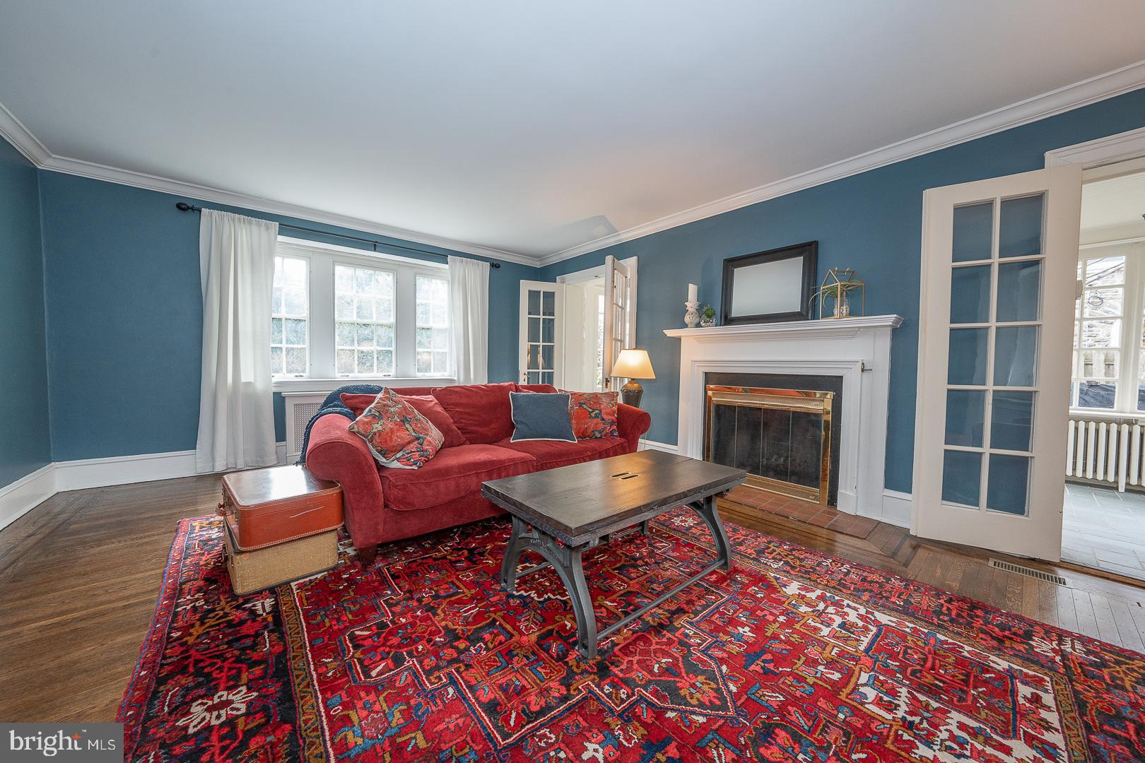 261 Kent Road Wynnewood, PA 19096 - Photo 14 of 98 a living room with furniture a rug and a fireplace