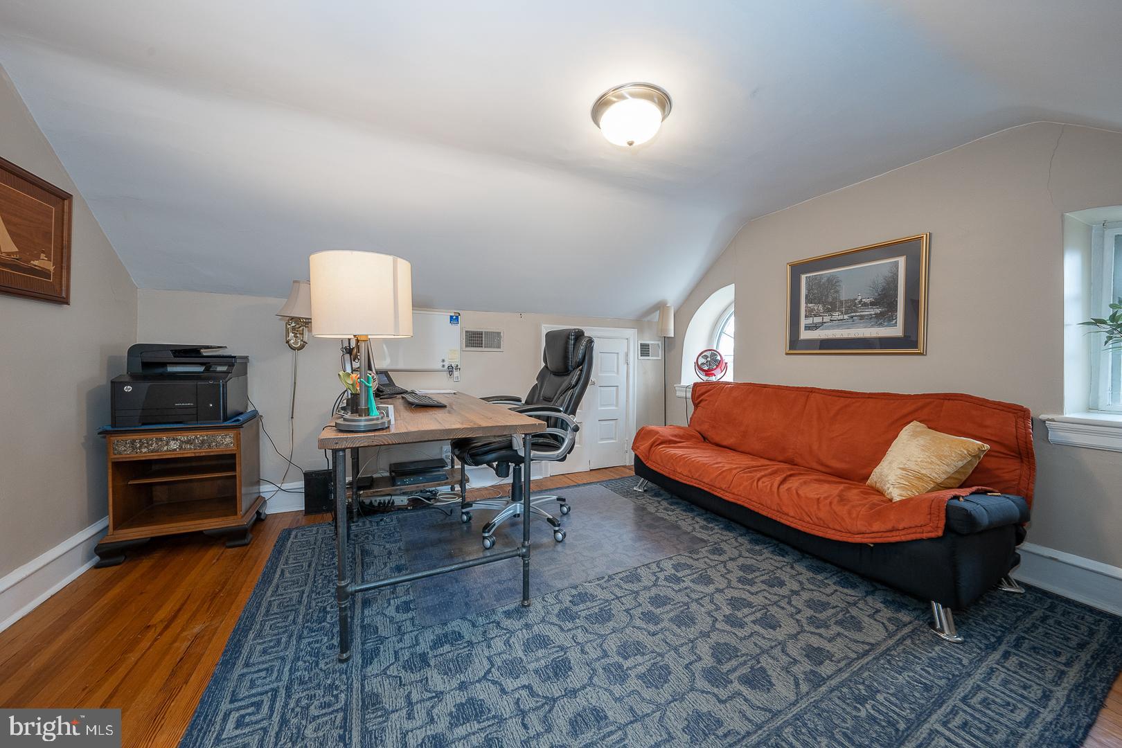 261 Kent Road Wynnewood, PA 19096 - Photo 66 of 98 a living room with furniture a rug and a lamp