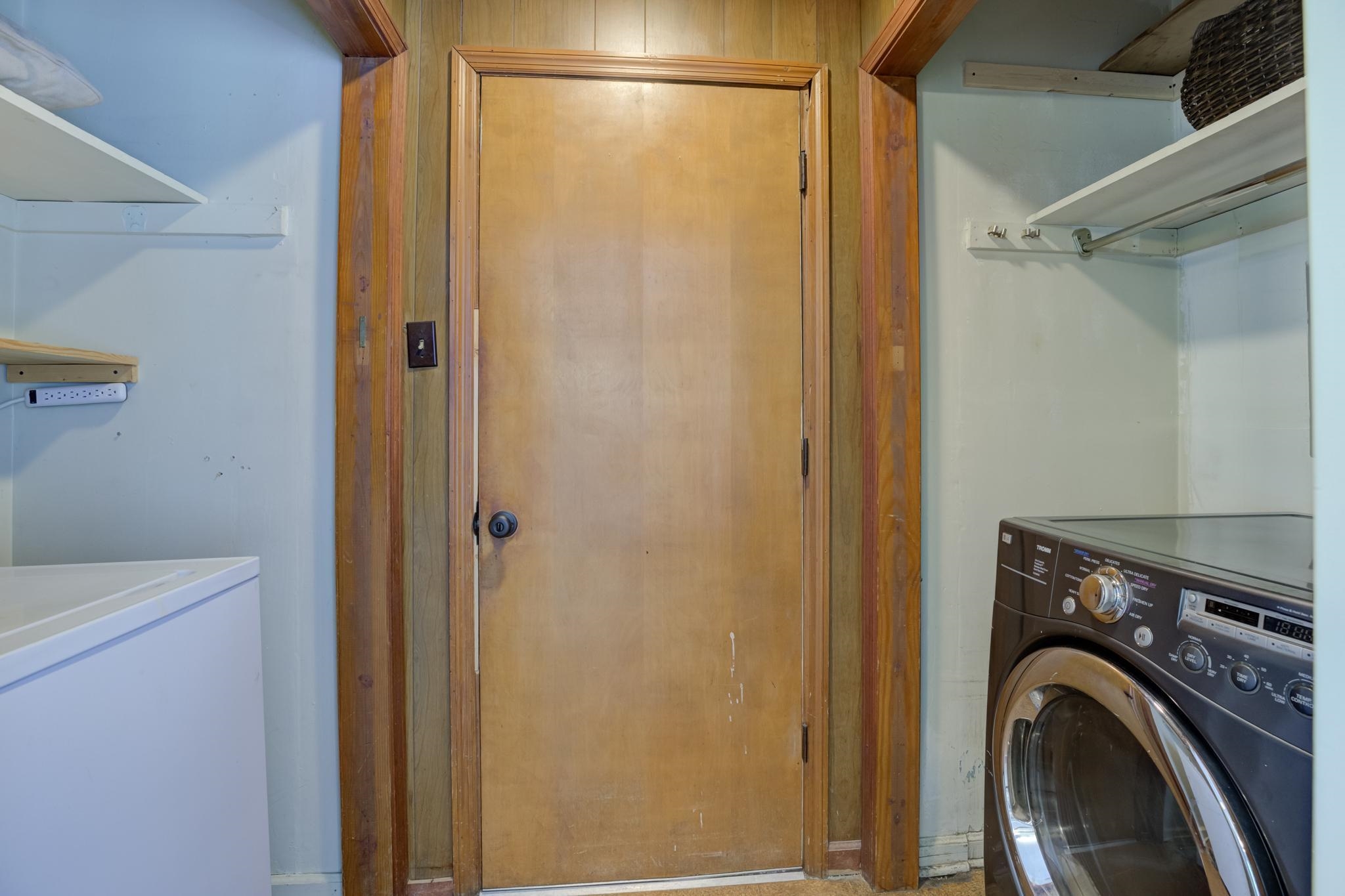 1427 Wilbec Road Memphis, TN 38117 - Photo 13 of 25 a room with a washing machine with washer and dryer