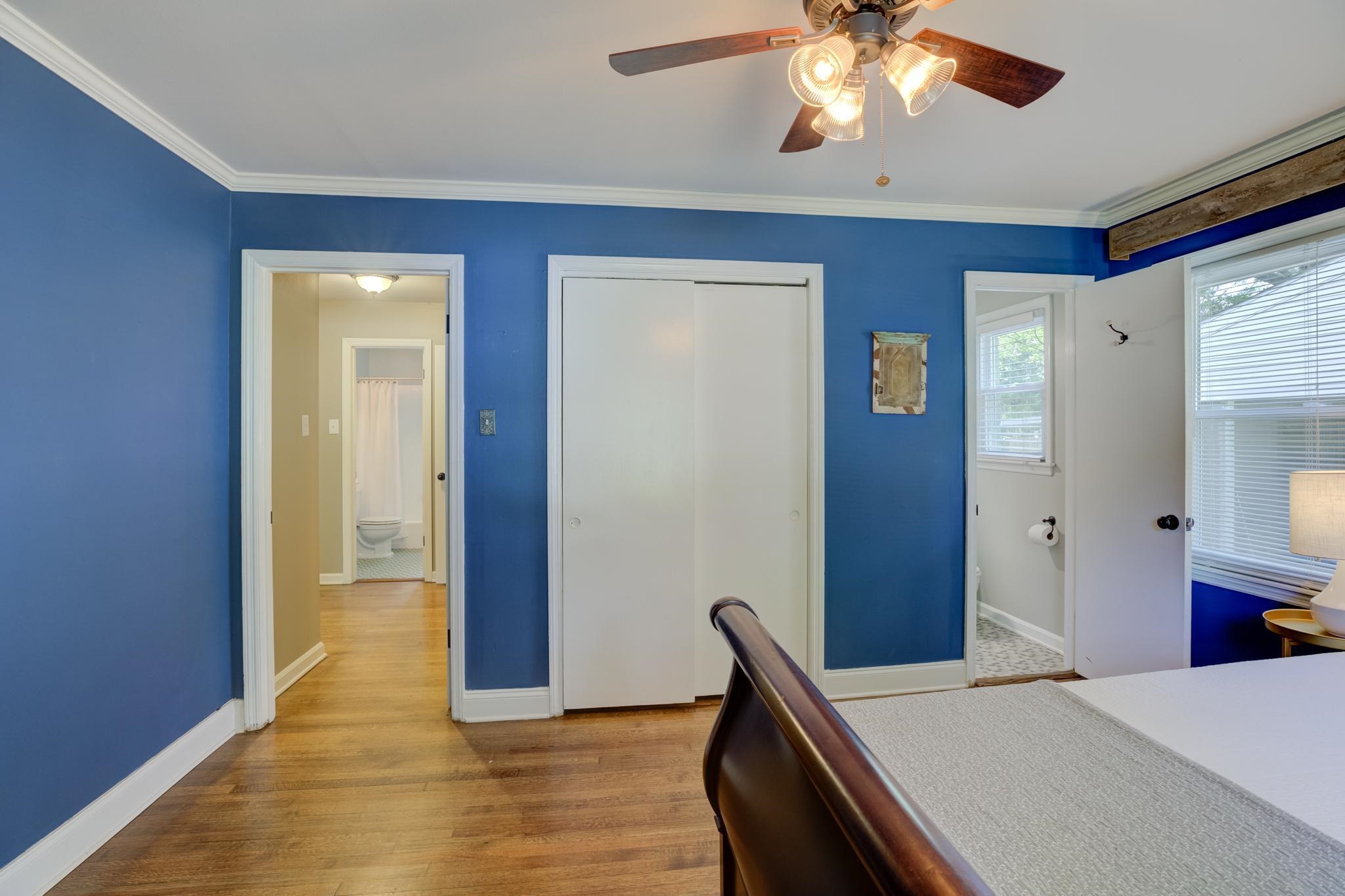 1427 Wilbec Road Memphis, TN 38117 - Photo 15 of 25 a bedroom with a bed and a chandelier