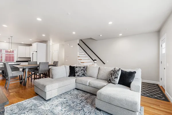 a living room with furniture and a rug