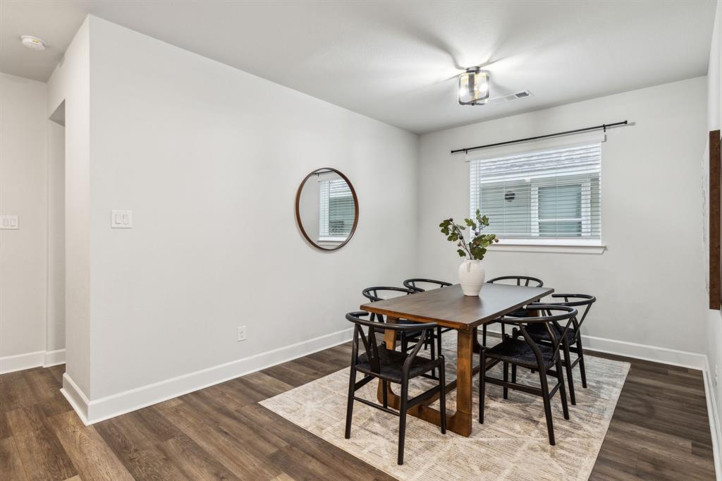 2417 Robin Way Northlake, TX 76247 - Photo 26 of 27 a view of a dining room with furniture and a chandelier