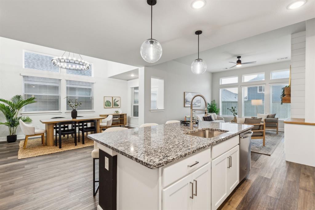 2417 Robin Way Northlake, TX 76247 - Photo 8 of 27 a kitchen with center island table and chairs