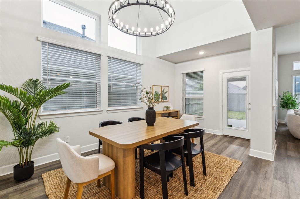 2417 Robin Way Northlake, TX 76247 - Photo 10 of 27 a view of a dining room with furniture window and wooden floor