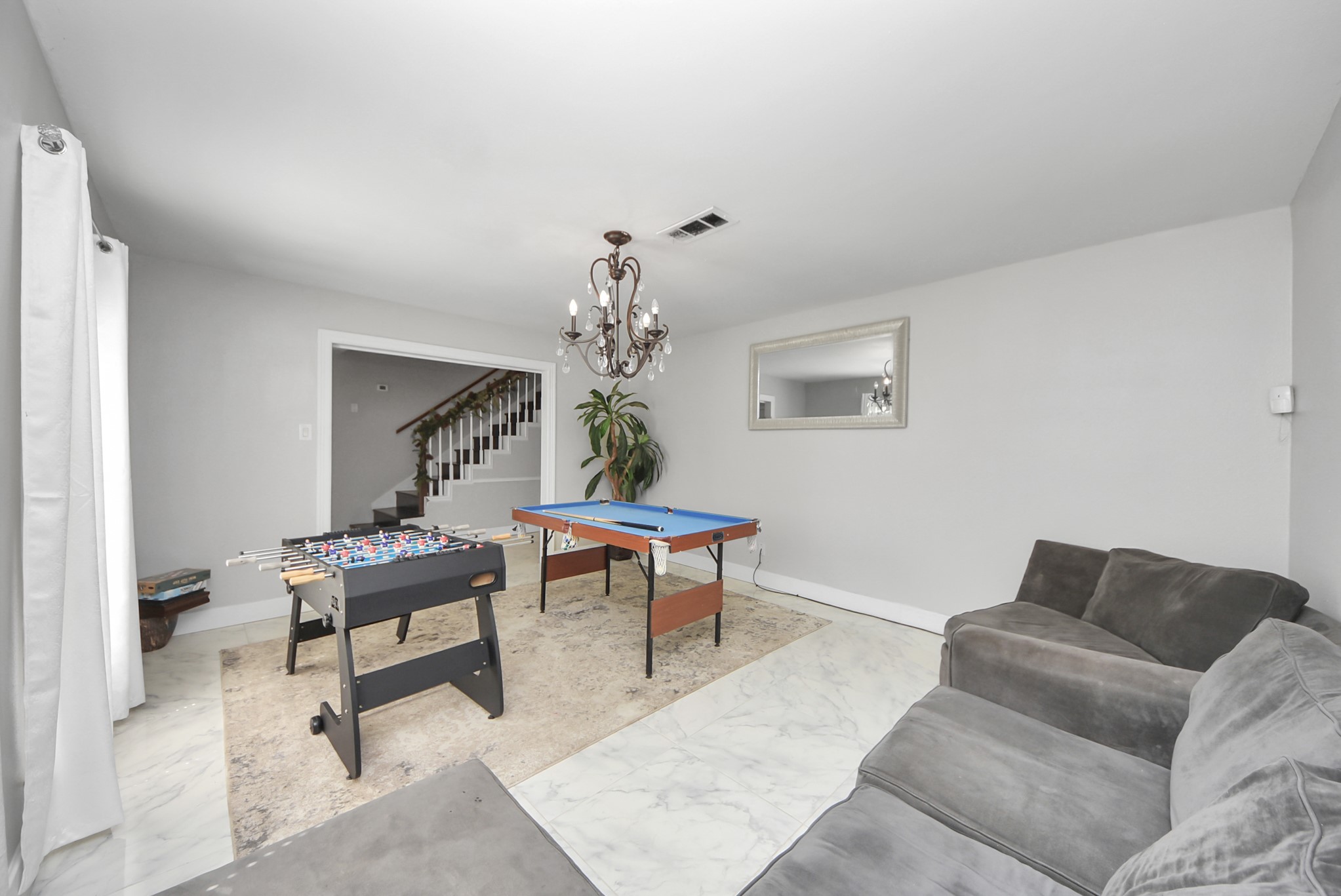 1011 Whitestone Lane Houston, TX 77073 - Photo 5 of 48 a living room with furniture and a chandelier
