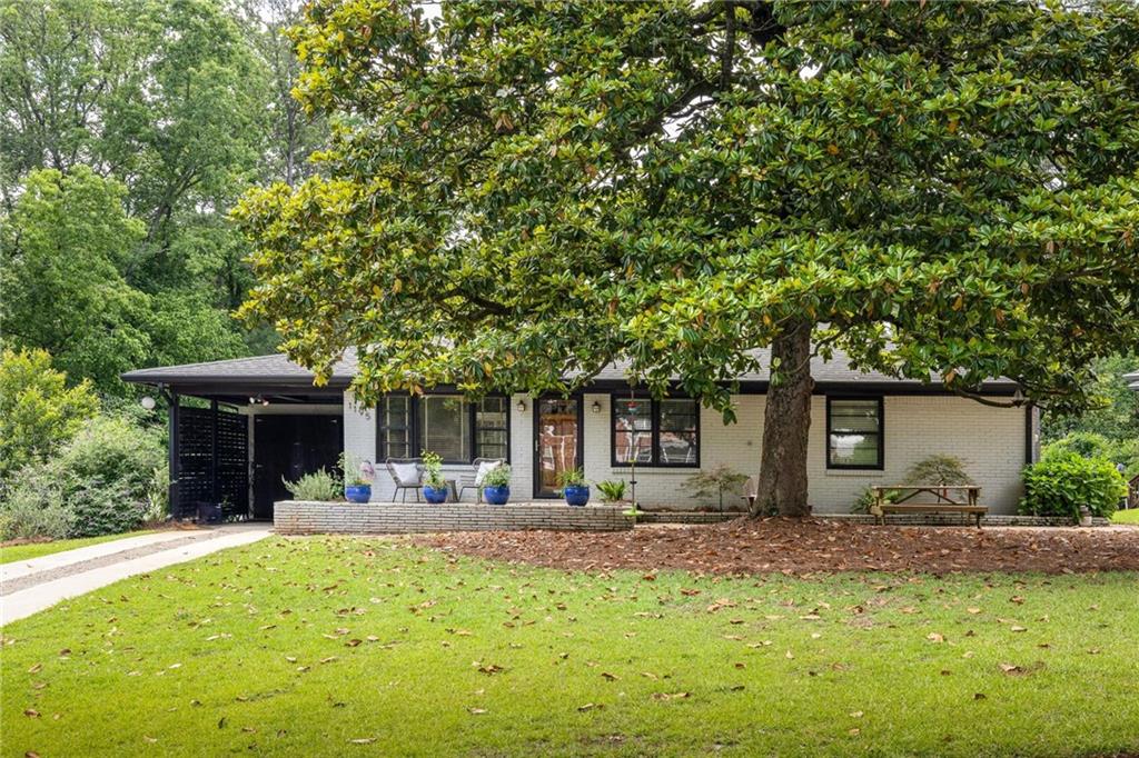 1195 Russell Drive Decatur, GA 30030 - Photo 1 of 1 a front view of house with yard and seating area