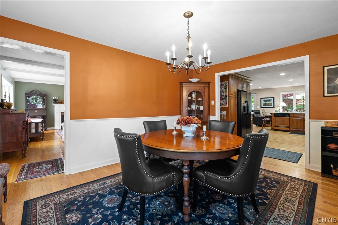 410 Meadow Road Geddes, NY 13219 - Photo 10 of 50 The formal dining room is open to the heart of the home, the kitchen.