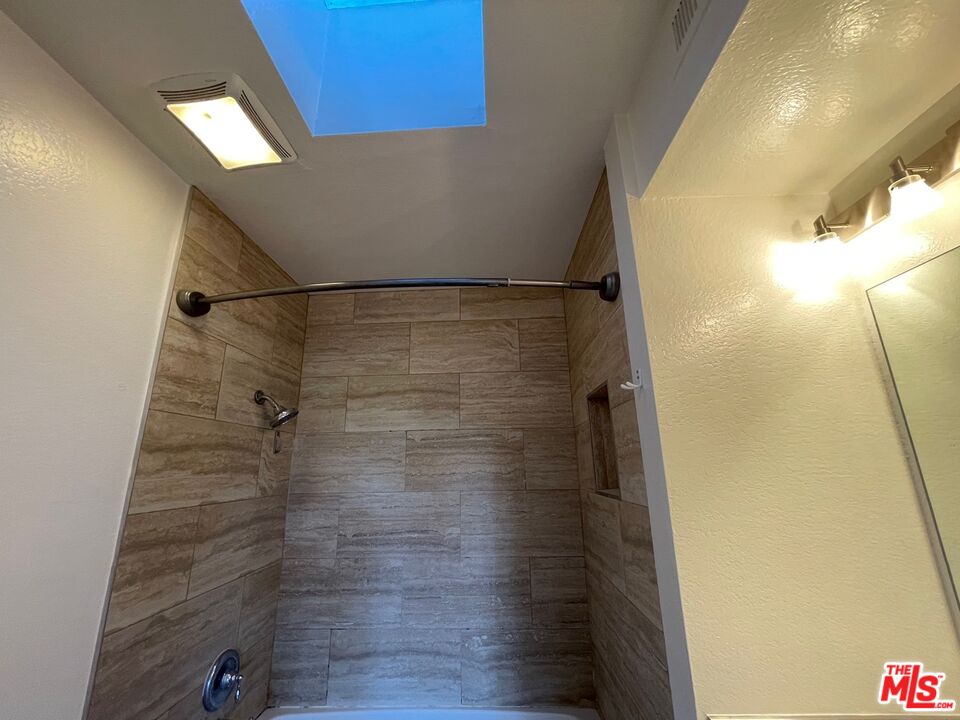 7327 Willoughby Avenue, Unit 6 Los Angeles, CA 90046 - Photo 14 of 24 a bathroom with a shower
