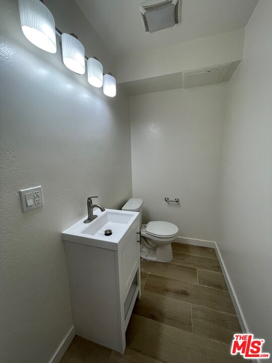7327 Willoughby Avenue, Unit 6 Los Angeles, CA 90046 - Photo 20 of 24 a bathroom with a sink and a toilet
