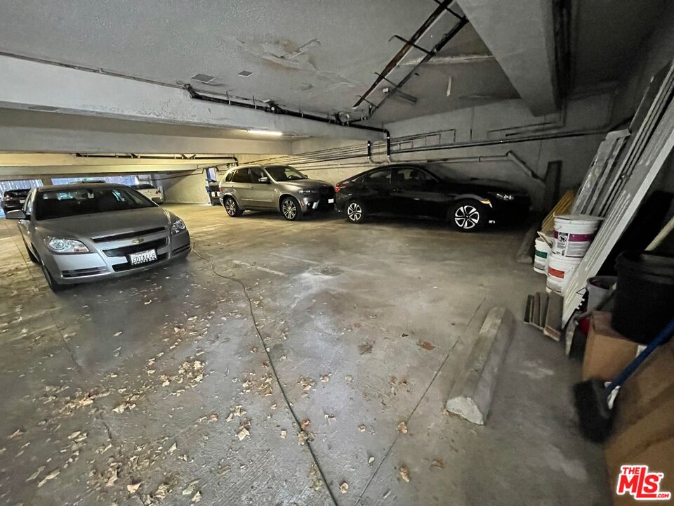 7327 Willoughby Avenue, Unit 6 Los Angeles, CA 90046 - Photo 23 of 24 a view of parking garage with cars parked