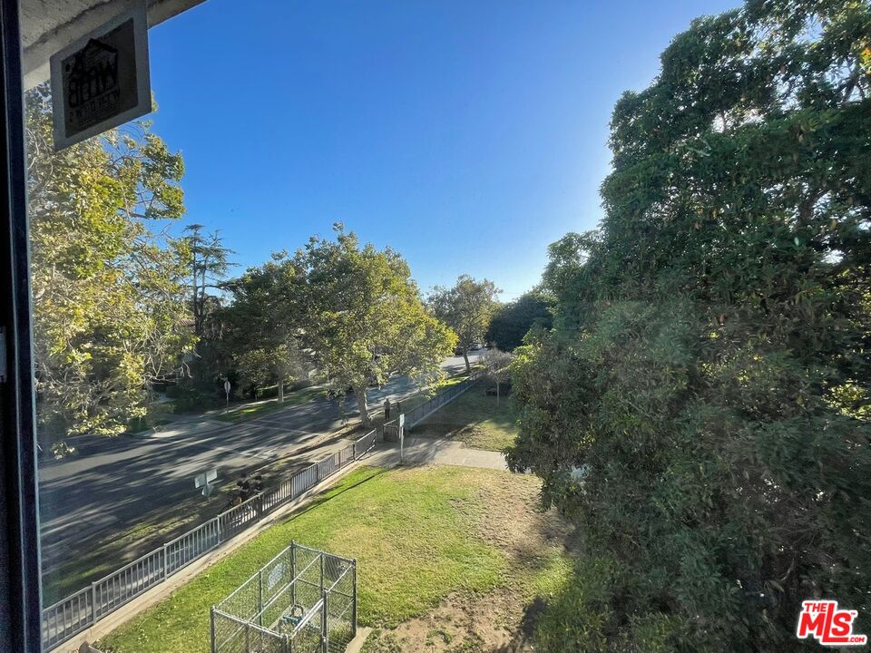7327 Willoughby Avenue, Unit 6 Los Angeles, CA 90046 - Photo 24 of 24 a view of a swimming pool with a yard
