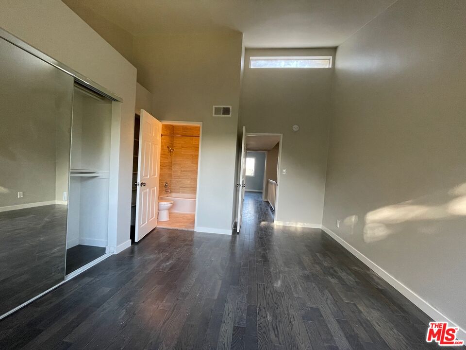 7327 Willoughby Avenue, Unit 6 Los Angeles, CA 90046 - Photo 5 of 24 a view of empty room with wooden floor
