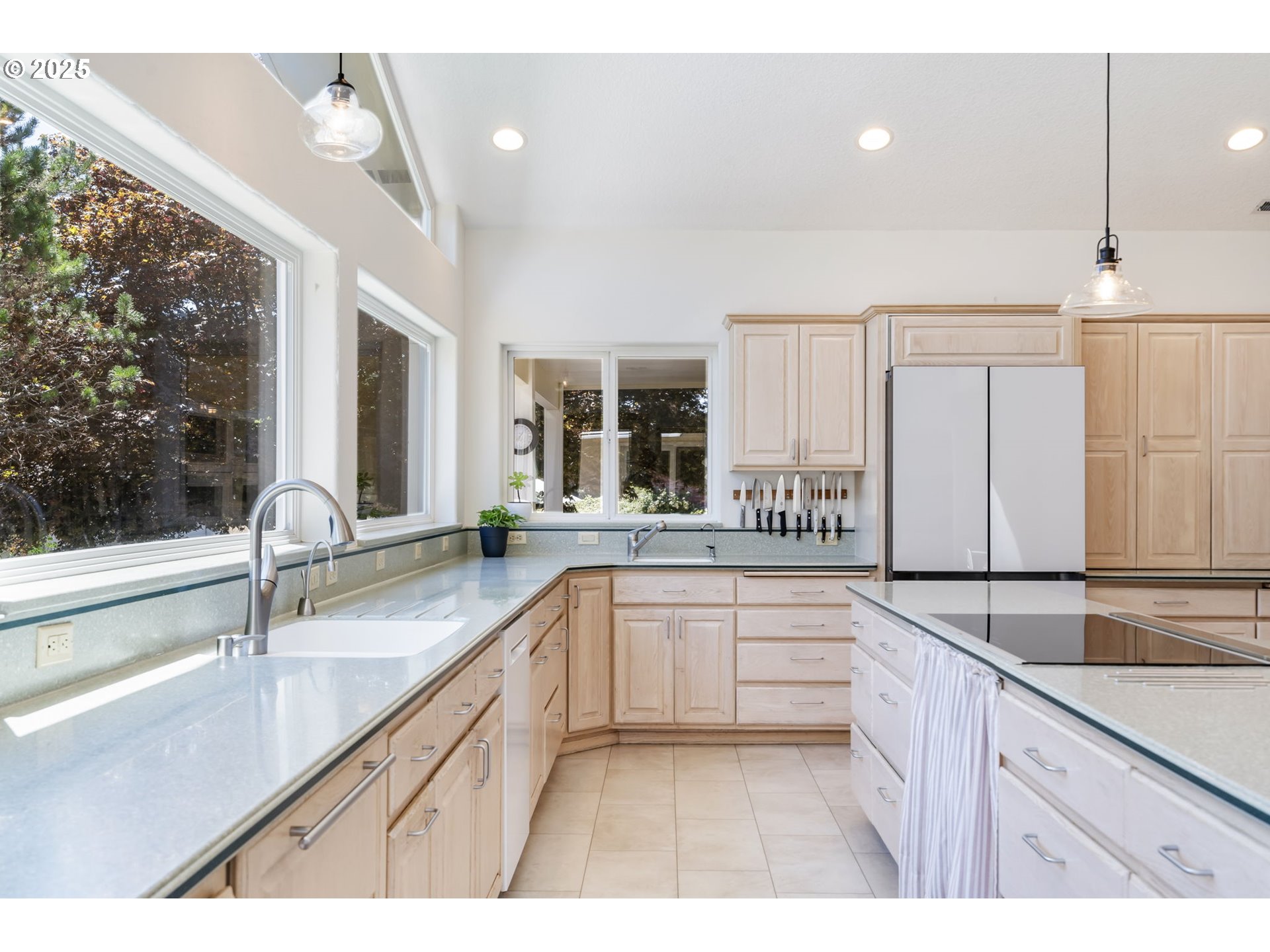 19117 Northeast 29th Avenue Ridgefield, WA 98642 - Photo 12 of 48 a large kitchen with a sink and cabinets
