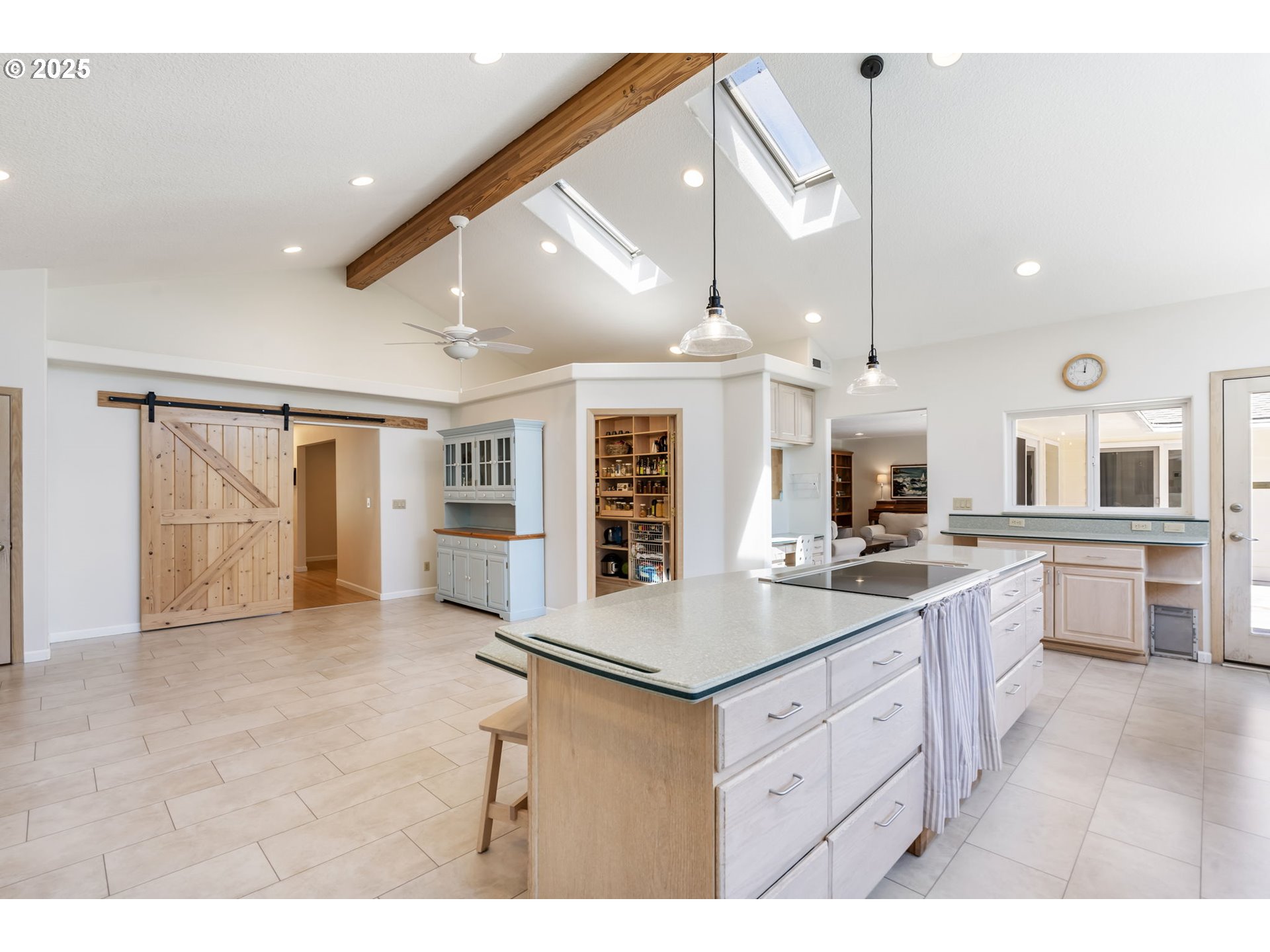 19117 Northeast 29th Avenue Ridgefield, WA 98642 - Photo 13 of 48 a kitchen with a counter top appliances and a ceiling fan