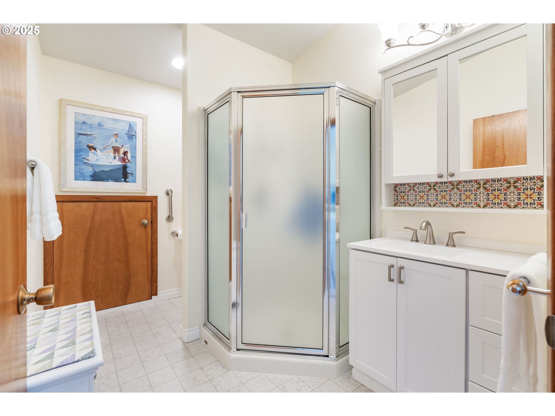 19117 Northeast 29th Avenue Ridgefield, WA 98642 - Photo 23 of 48 a bathroom with a shower sink and mirror