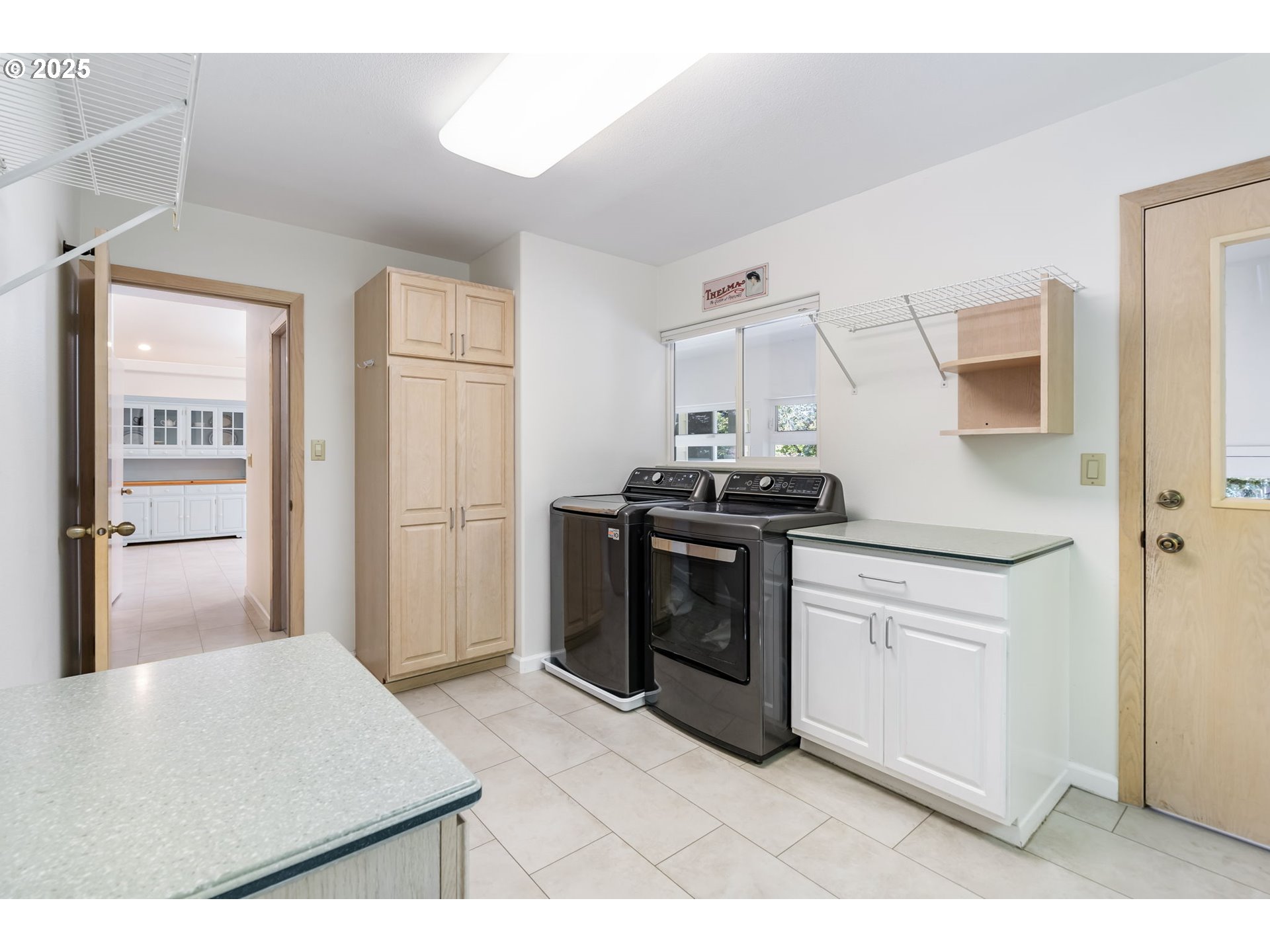 19117 Northeast 29th Avenue Ridgefield, WA 98642 - Photo 24 of 48 a kitchen with stainless steel appliances a stove a refrigerator and cabinets
