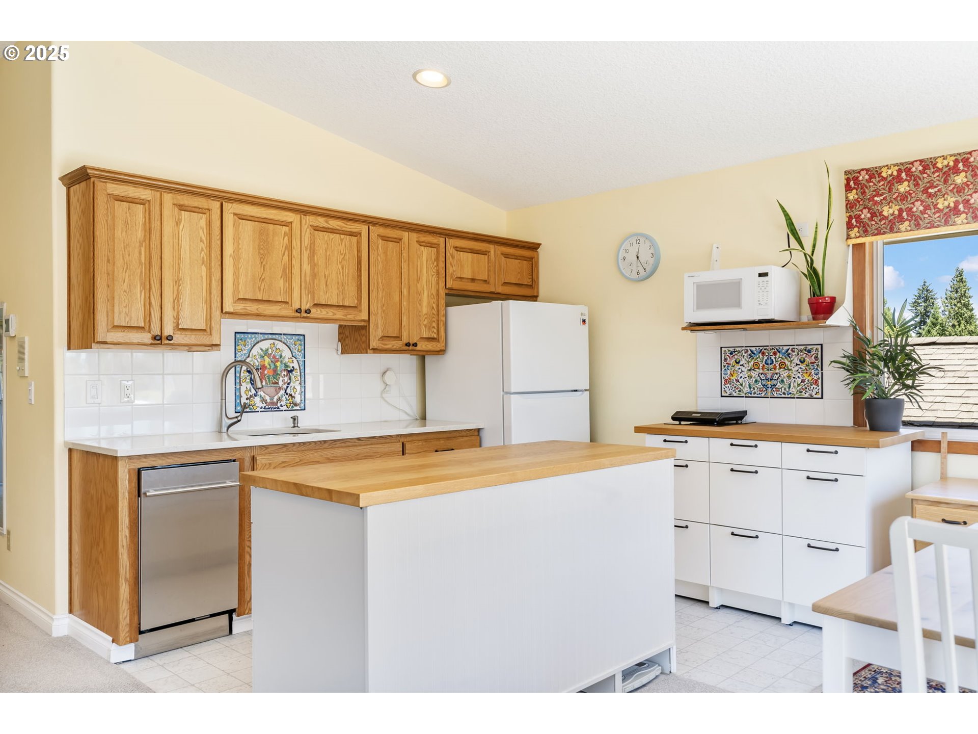 19117 Northeast 29th Avenue Ridgefield, WA 98642 - Photo 33 of 48 a kitchen with a sink a stove and cabinets