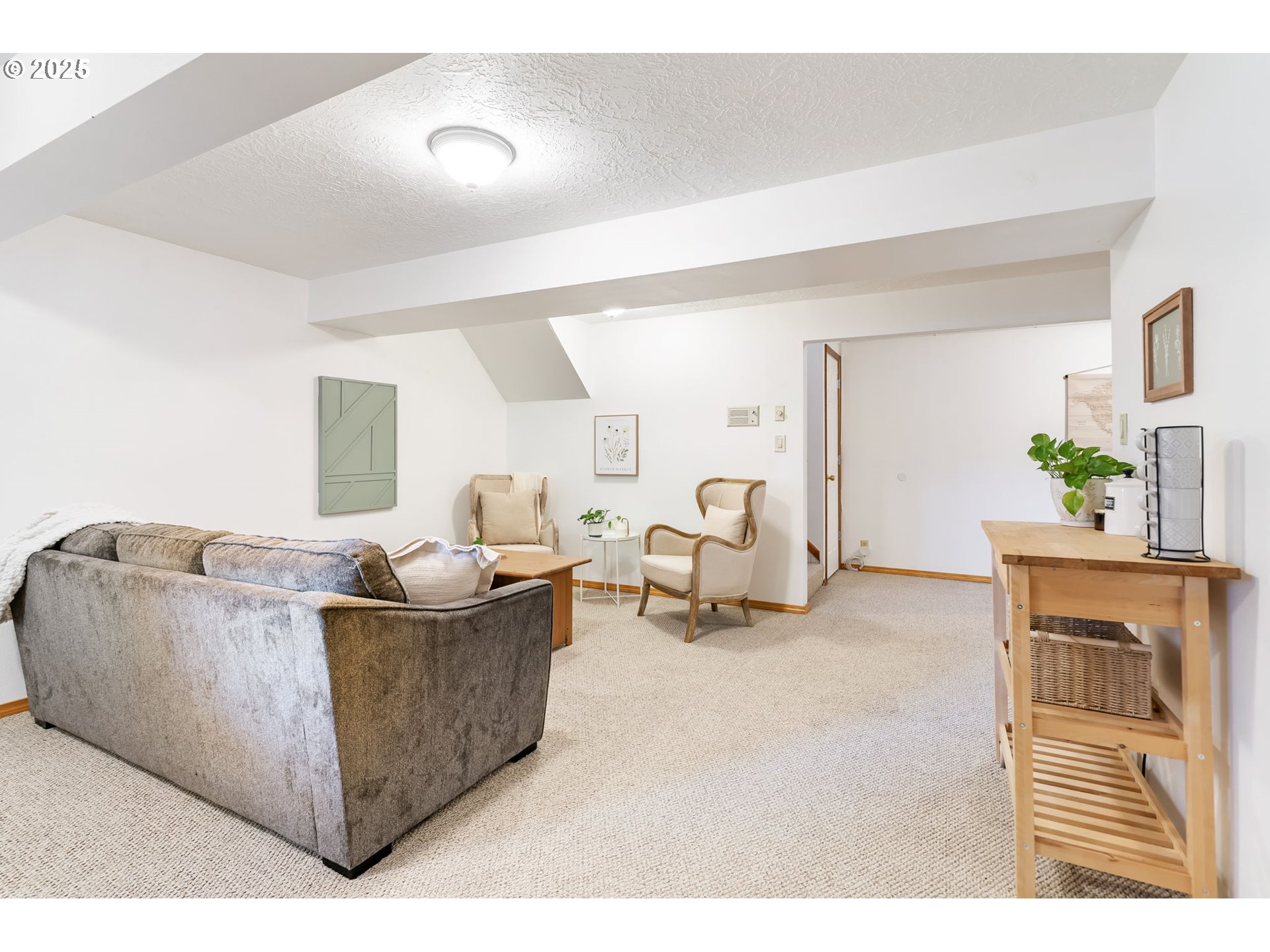 19117 Northeast 29th Avenue Ridgefield, WA 98642 - Photo 38 of 48 a living room with furniture and a flat screen tv