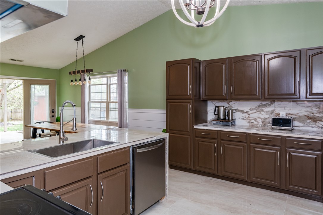 175 Marrett Farm Road Englewood, OH 45322 - Photo 13 of 29 This spacious kitchen offers a large island with ample counter space and modern appliances.
