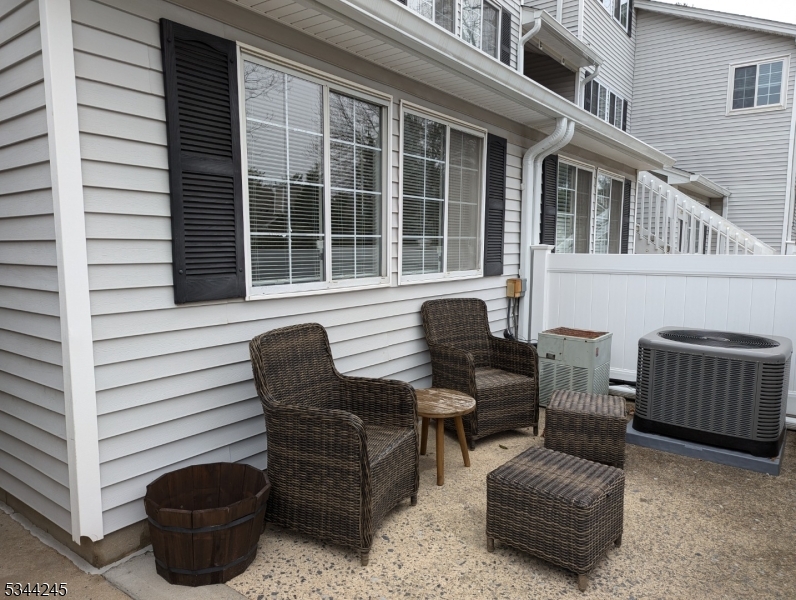 13 Hyde Court Bedminster, NJ 07921 - Photo 1 of 14 a view of a patio with couches and a potted plant on a table