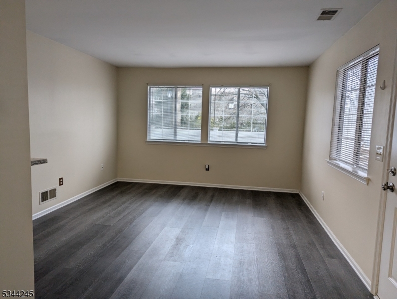 13 Hyde Court Bedminster, NJ 07921 - Photo 2 of 14 an empty room with wooden floor and windows