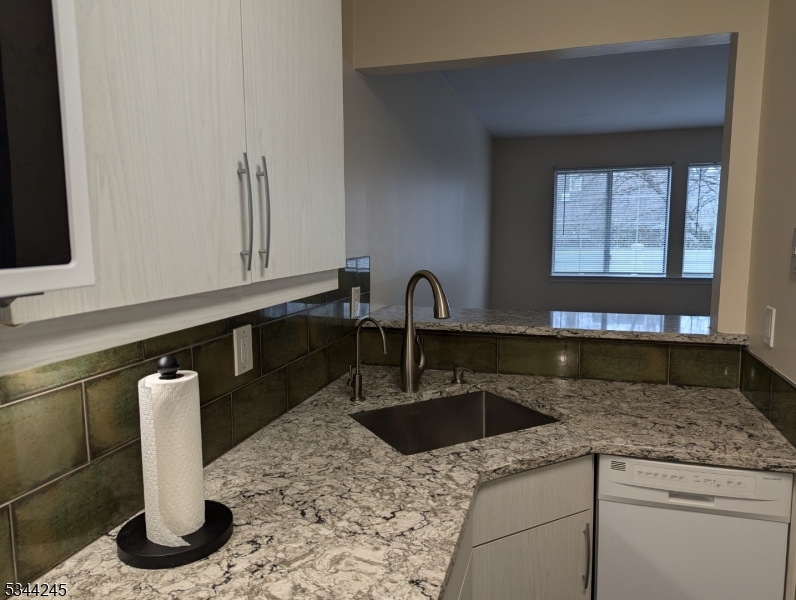 13 Hyde Court Bedminster, NJ 07921 - Photo 5 of 14 a kitchen with stainless steel appliances granite countertop a sink and a microwave