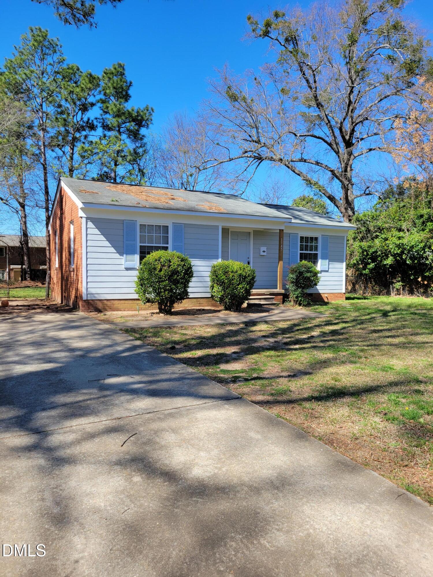 a front view of a house with yard