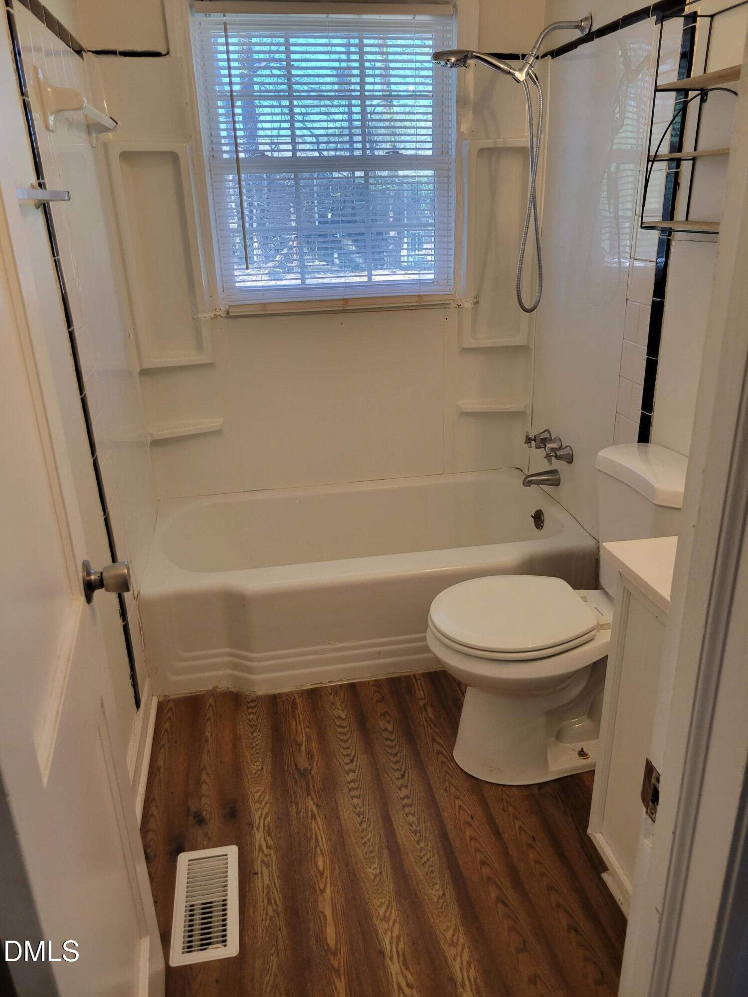 1145 Brighton Road Raleigh, NC 27610 - Photo 8 of 10 a bathroom with a toilet and a shower