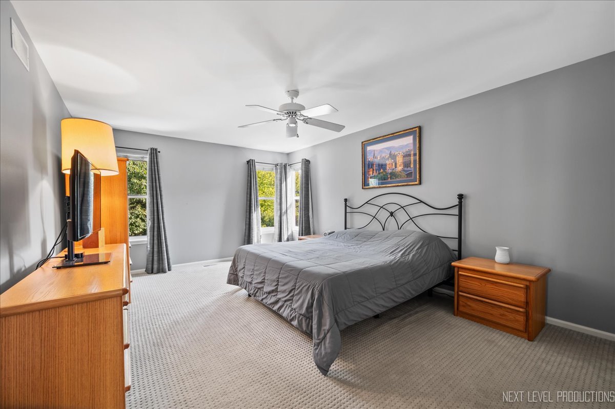 1244 Churchill Road Bartlett, IL 60103 - Photo 15 of 33 a bedroom with bed and window