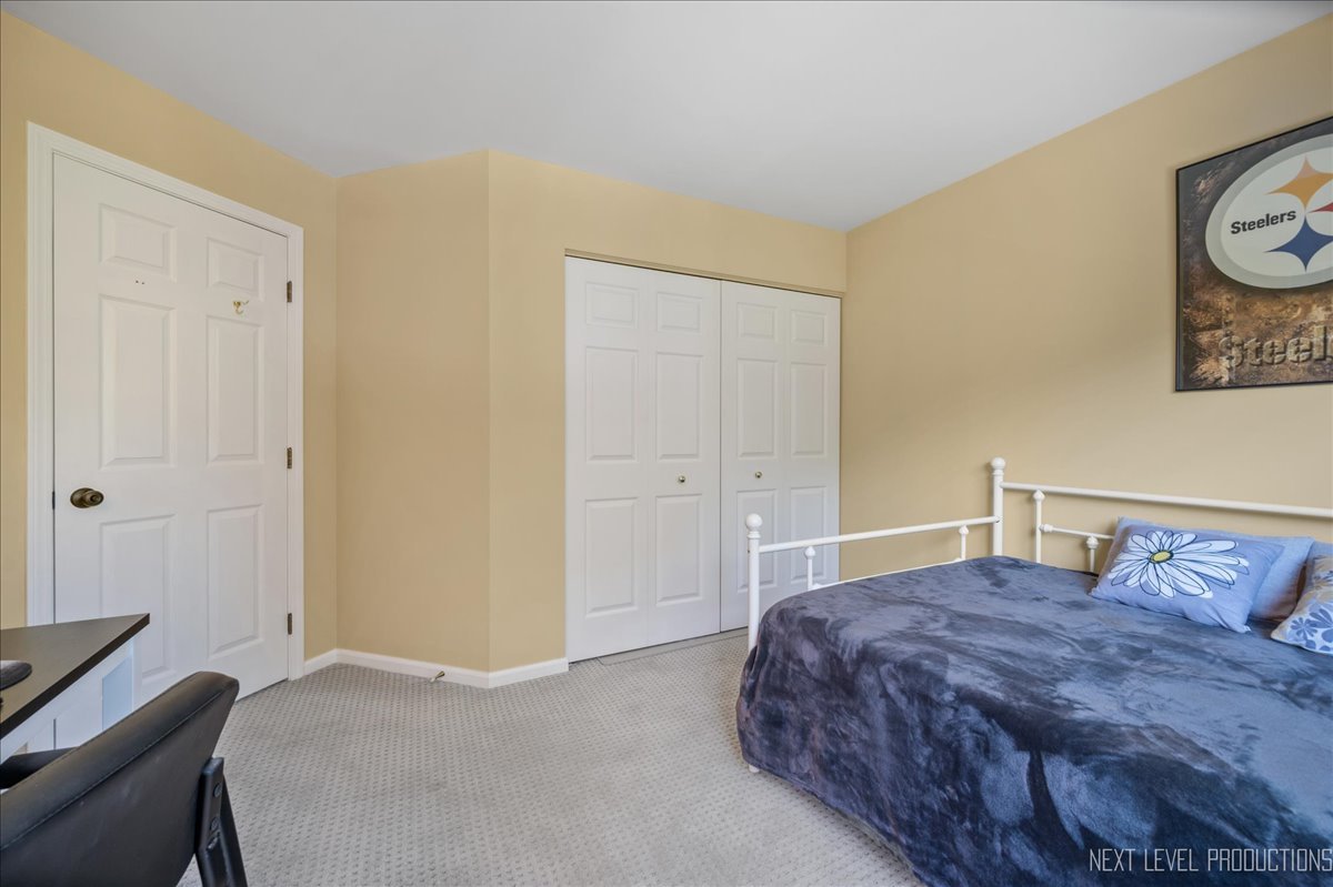 1244 Churchill Road Bartlett, IL 60103 - Photo 23 of 33 a bedroom with a bed and painting on the wall