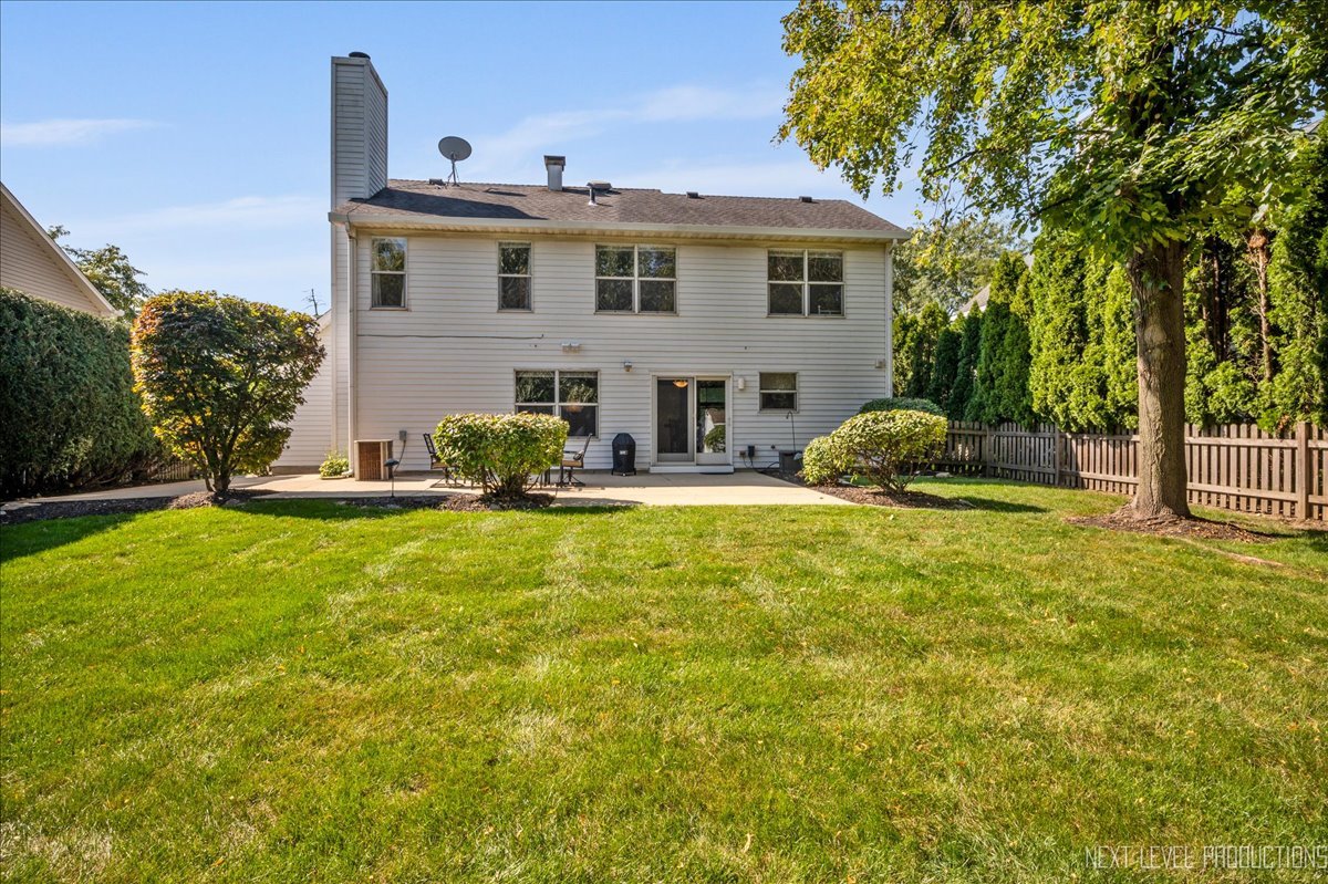 1244 Churchill Road Bartlett, IL 60103 - Photo 31 of 33 a front view of a house with garden