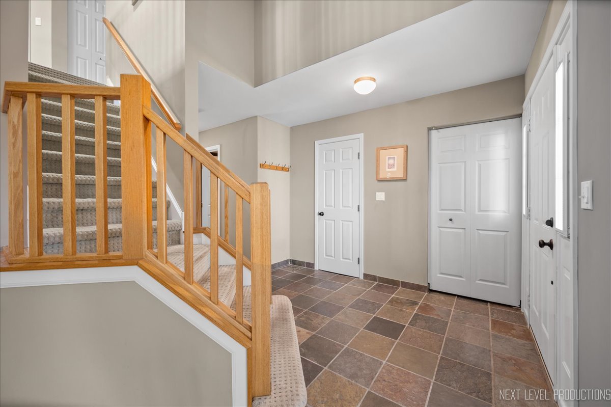 1244 Churchill Road Bartlett, IL 60103 - Photo 5 of 33 a view of an entryway with staircase