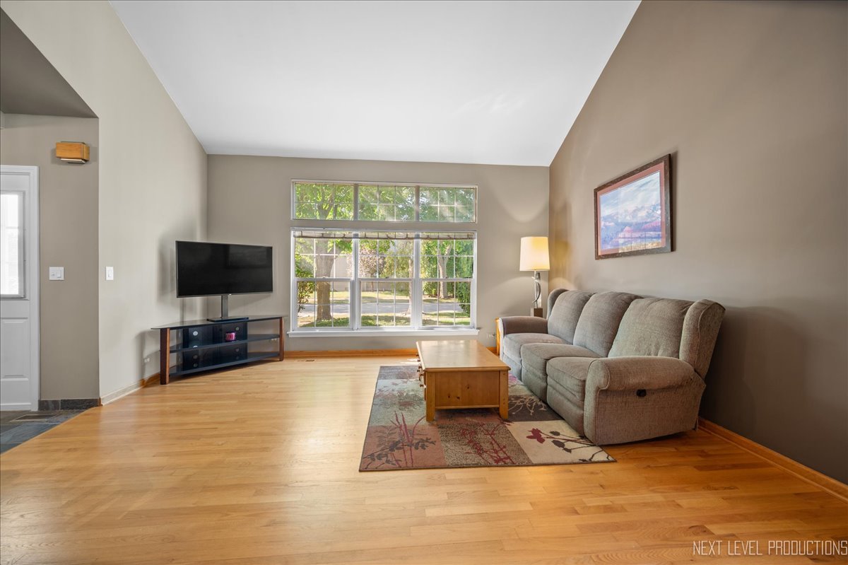 1244 Churchill Road Bartlett, IL 60103 - Photo 8 of 33 a living room with furniture and a flat screen tv