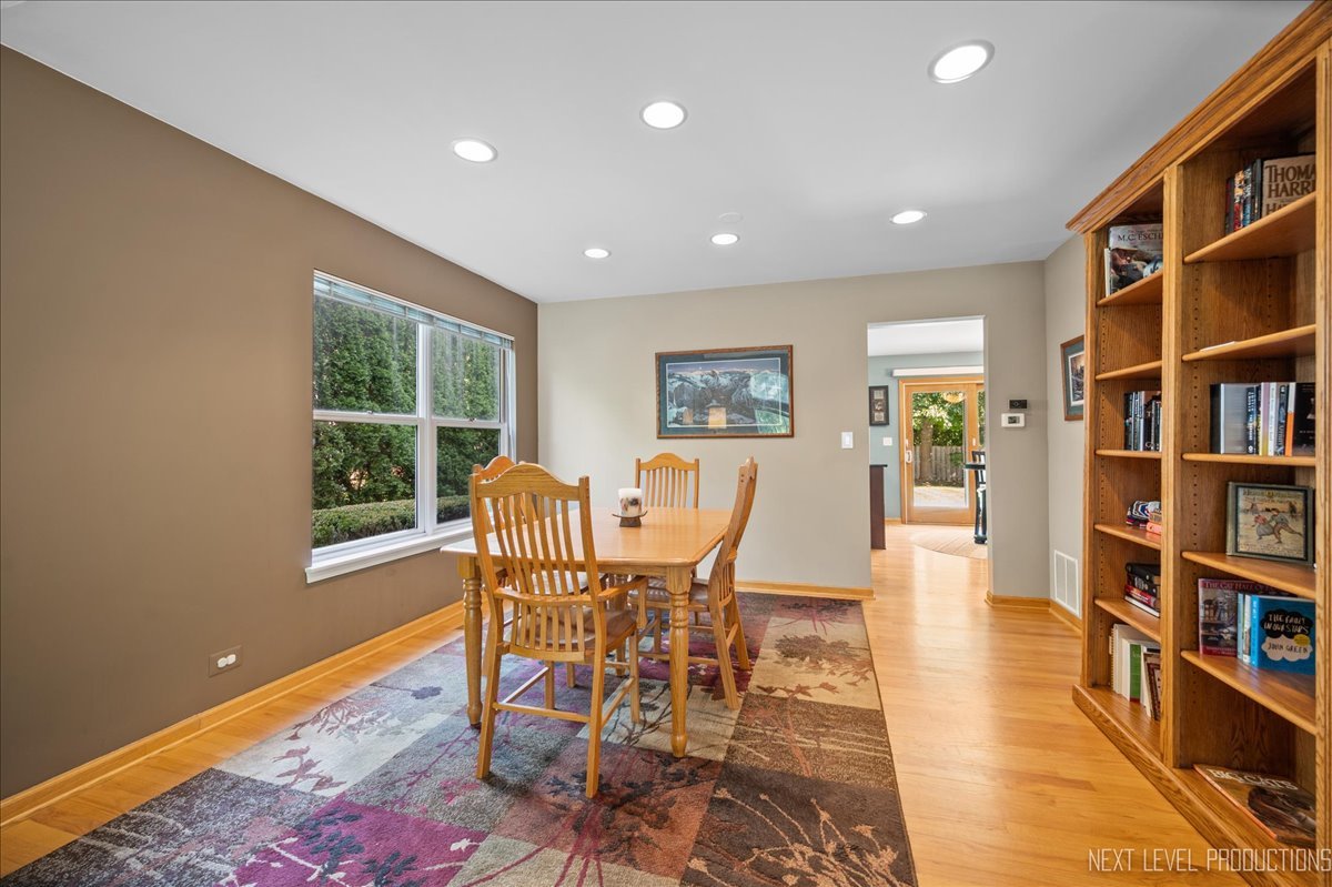 1244 Churchill Road Bartlett, IL 60103 - Photo 9 of 33 a view of a dining room with furniture and a book shelf