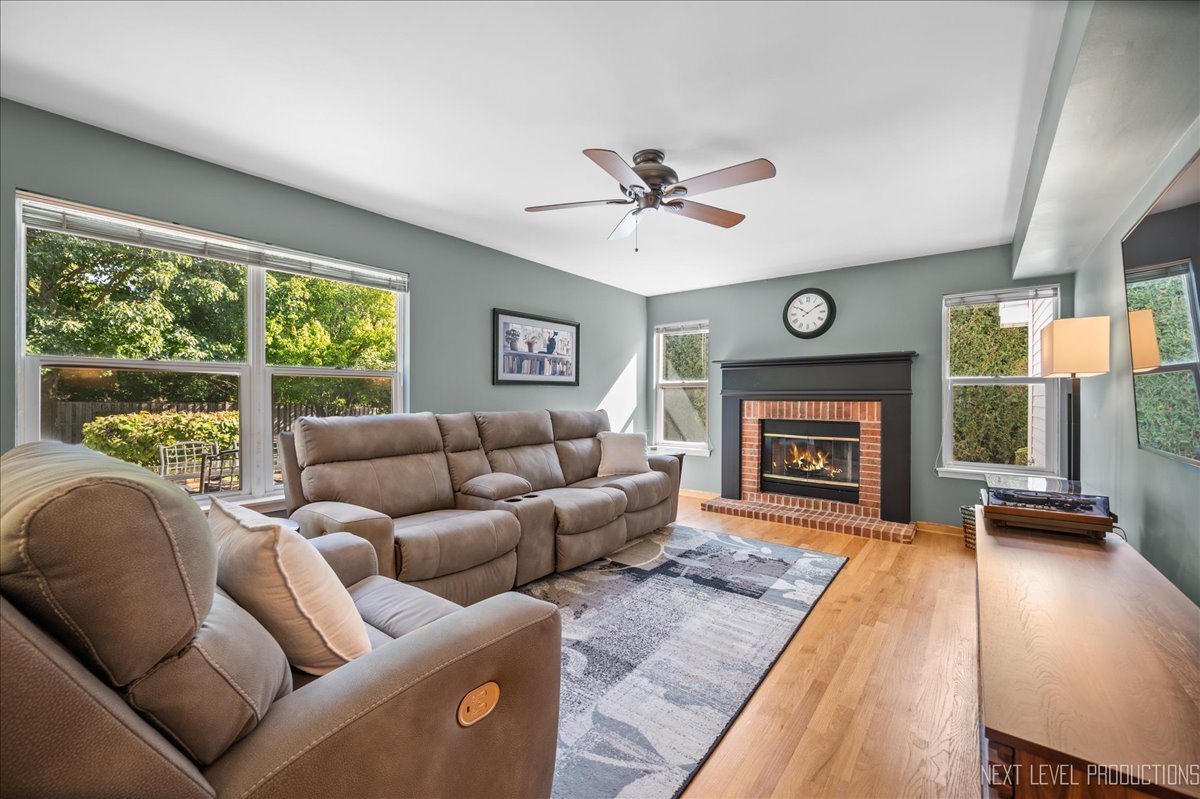 1244 Churchill Road Bartlett, IL 60103 - Photo 10 of 33 a living room with furniture and a fireplace