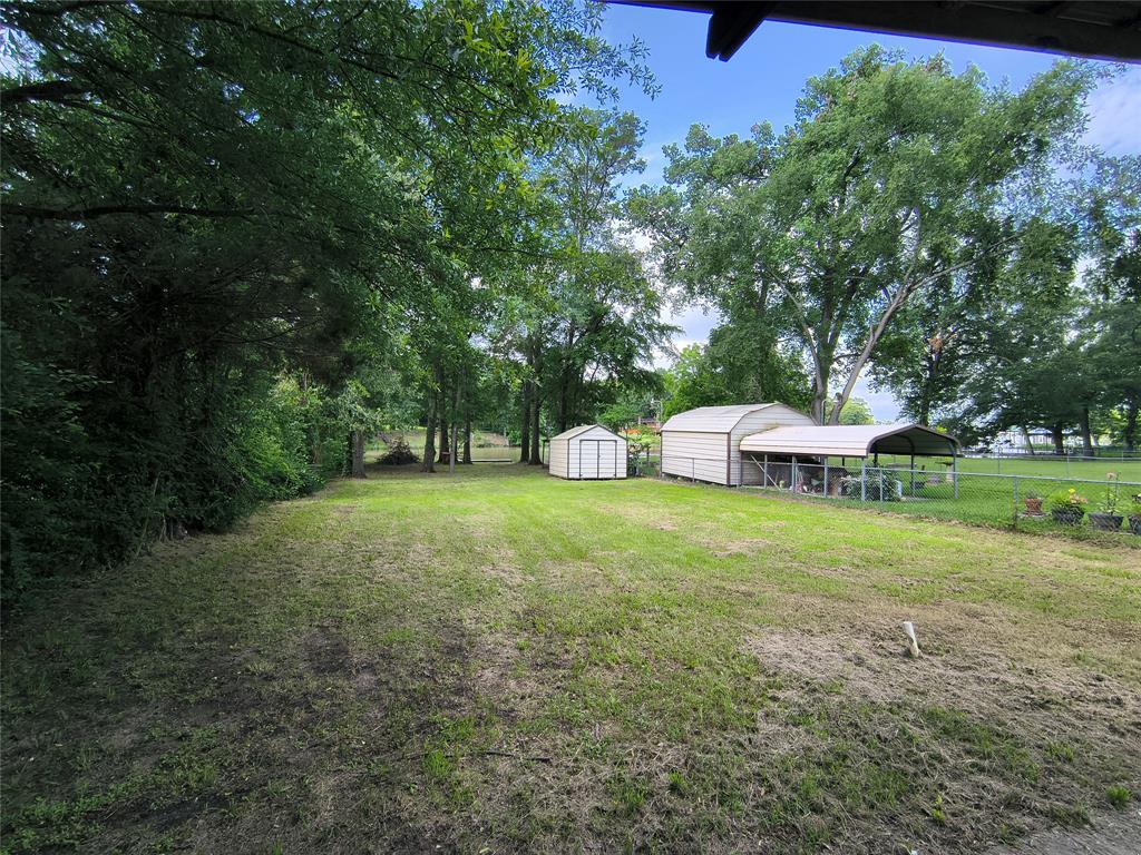 180 Arrowhead Street Mabank, TX 75156 - Photo 26 of 26 a view of a house with a yard and sitting area