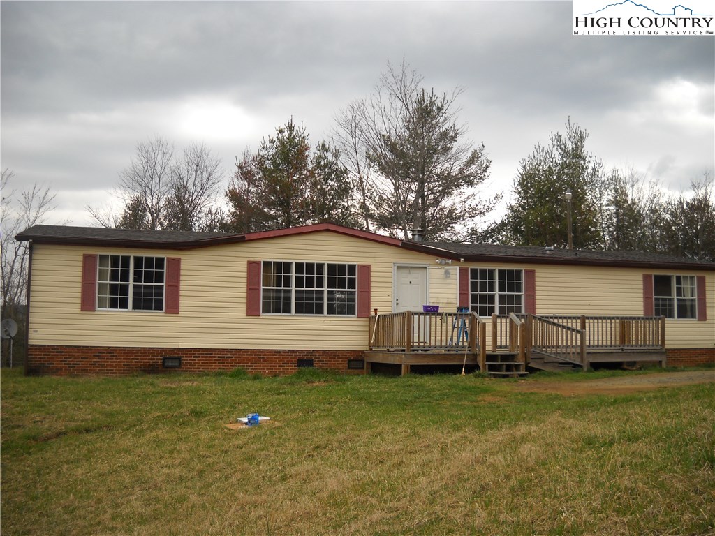 605 Wagoner Ridge Road Ennice, NC 28623 - Photo 1 of 5 a front view of a house with a yard