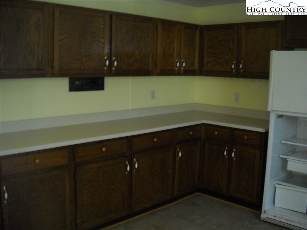 605 Wagoner Ridge Road Ennice, NC 28623 - Photo 2 of 5 a kitchen with a cabinets and a sink